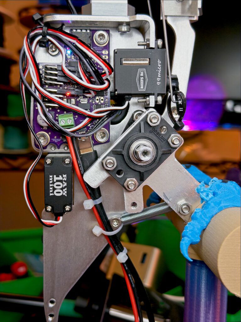 A photo of the internals of Kenny. It shows his metal frame, and how the Creature Controller (2025 Edition) is wired up.
